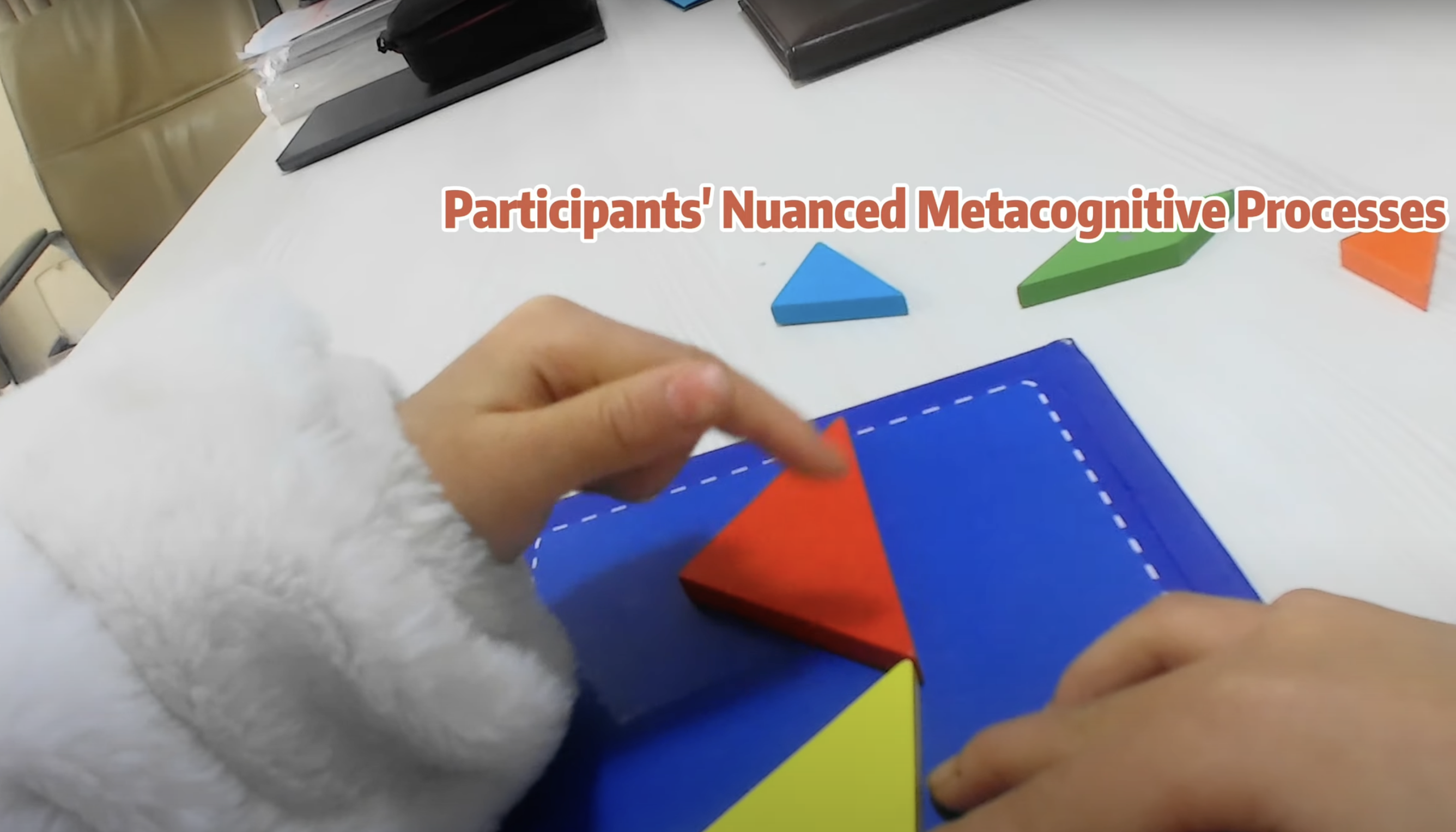 two child-sized hands working on a puzzle, from the child's point of view